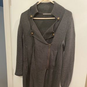 Grey sweater with brass accents